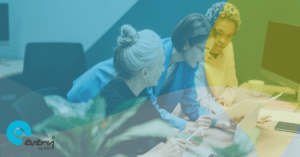 3 women looking at a document